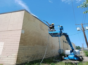 Pressure washing home exterior